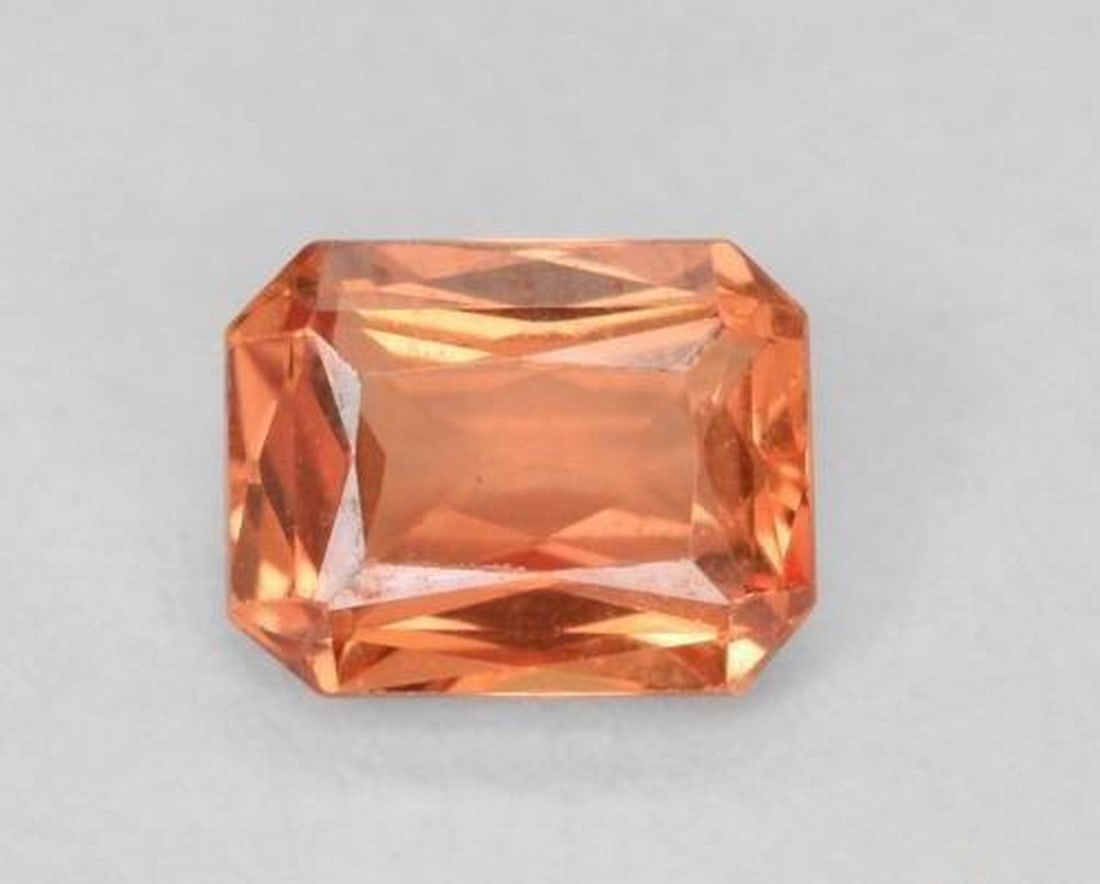 0.55 ct Natural Orange Red Sapphire, Octagon/Scissor Cut, VS, Tanzania: 0.55 ct Natural Orange Red Sapphire, Octagon/Scissor Cut, VS, Tanzania Natural sapphire gemstone weighing 0.55 ct, cut in an octagon/scissor facet shape with an orange-red color. The gem measures 5.01