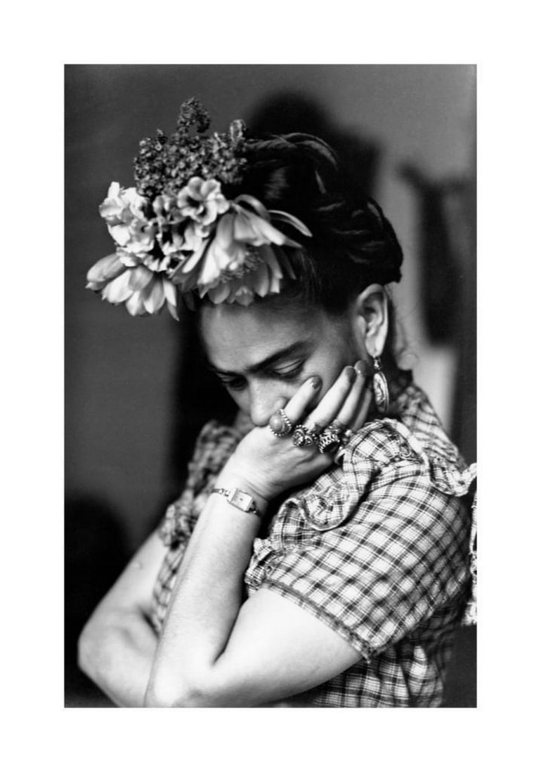 Frida Kahlo Black & White Poster: Frida Kahlo Black & White Poster A black and white photographic print of Mexican artist Frida Kahlo. The artwork highlights her iconic features and legacy, celebrating her as a symbol of feminism.