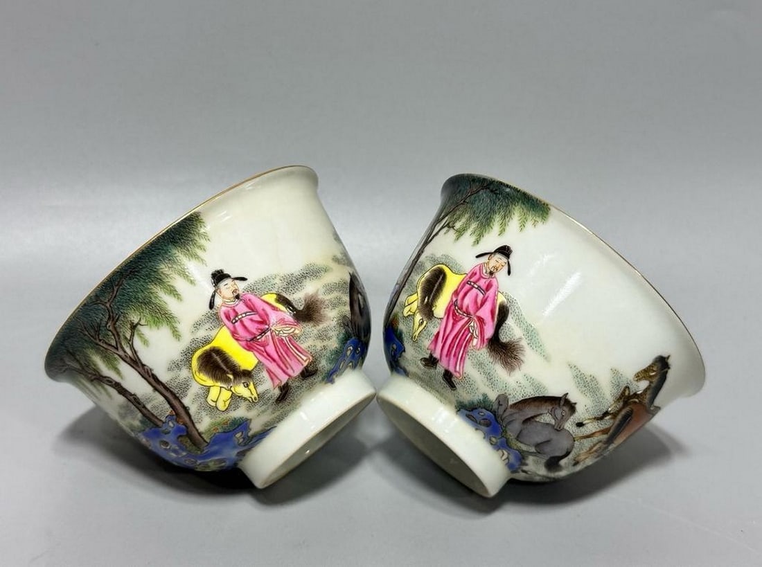 Qianlong Year of the Qing Dynasty Eight Horses Picture Cups, Pair: Qianlong Year of the Qing Dynasty Eight Horses Picture Cups, Pair A rare pair of porcelain cups from the Qianlong period, each finely painted with the renowned motif of eight horses. The design captur