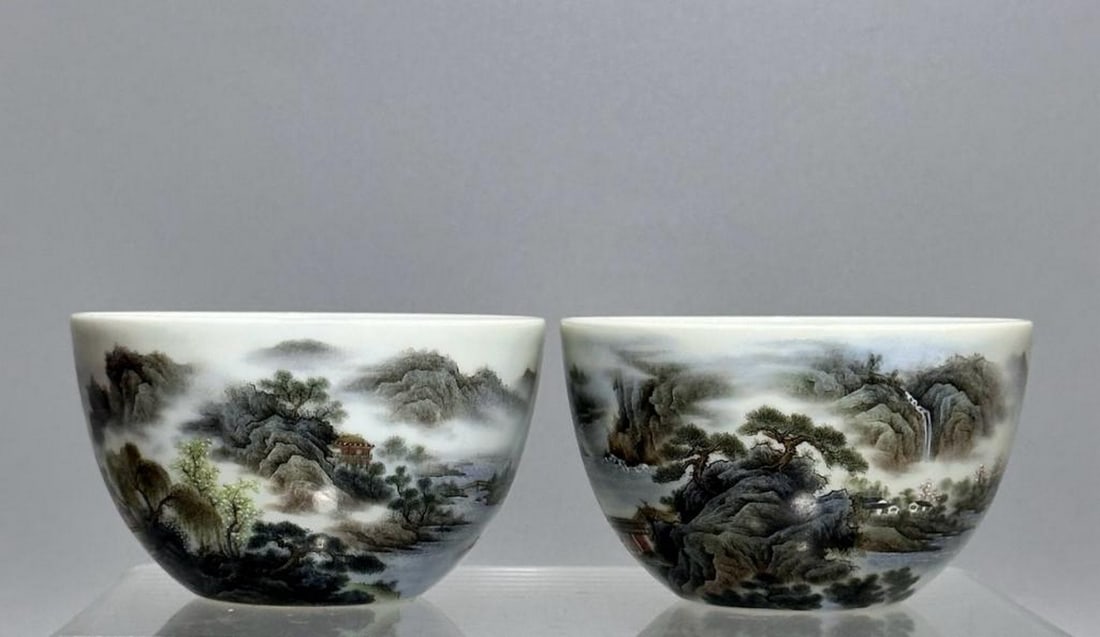 Yongzheng Year of the Qing Dynasty Famille Rose Landscape Pattern Cups, Pair: Yongzheng Year of the Qing Dynasty Famille Rose Landscape Pattern Cups, Pair A delicate pair of porcelain cups from the Yongzheng period of the Qing Dynasty, finely decorated in vibrant famille rose e