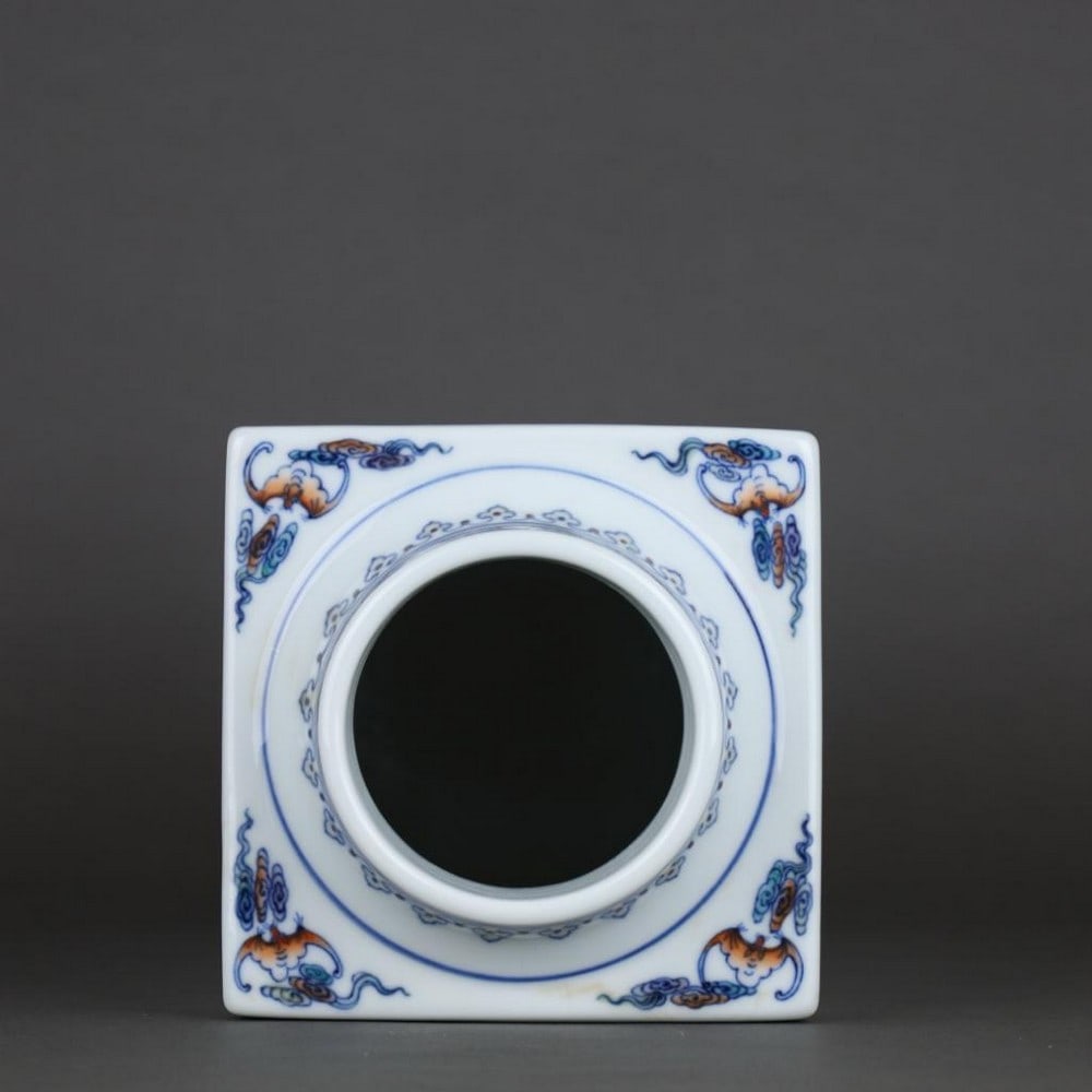 Qing Qianlong Doucai Cloud, Bat, and Dragon Pattern Square Cong-Style Bottle: Qing Qianlong Doucai Cloud, Bat, and Dragon Pattern Square Cong-Style Bottle A finely crafted square cong-style bottle from the Qianlong period of the Qing Dynasty, decorated in vibrant doucai enamel.