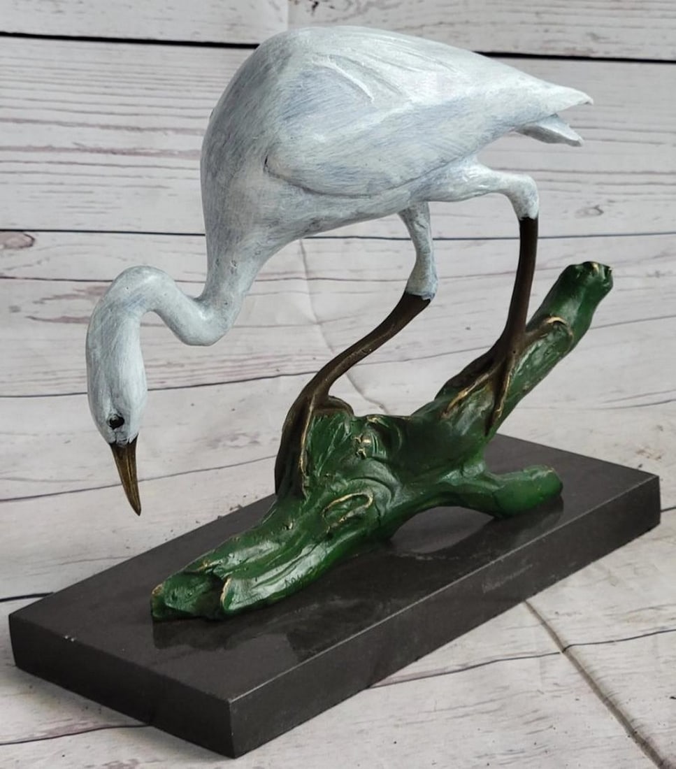 Original Patinated Bronze Egret Sculpture by Milo - 8" x 8.5": Original Patinated Bronze Egret Sculpture by Milo - 8" x 8.5" levate your space with the elegance of nature through this stunning bronze egret sculpture by renowned artist Milo. Crafted using
