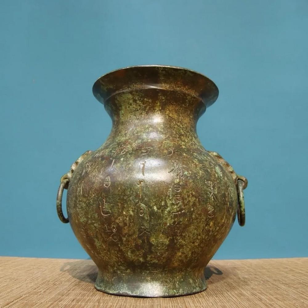 Chinese Handmade Bronze Inscribed Double Ring Jar Statue: Chinese Handmade Bronze Inscribed Double Ring Jar Statue This rare and exquisite handmade bronze double ring jar statue is a stunning example of traditional Chinese craftsmanship. The jar, with its d