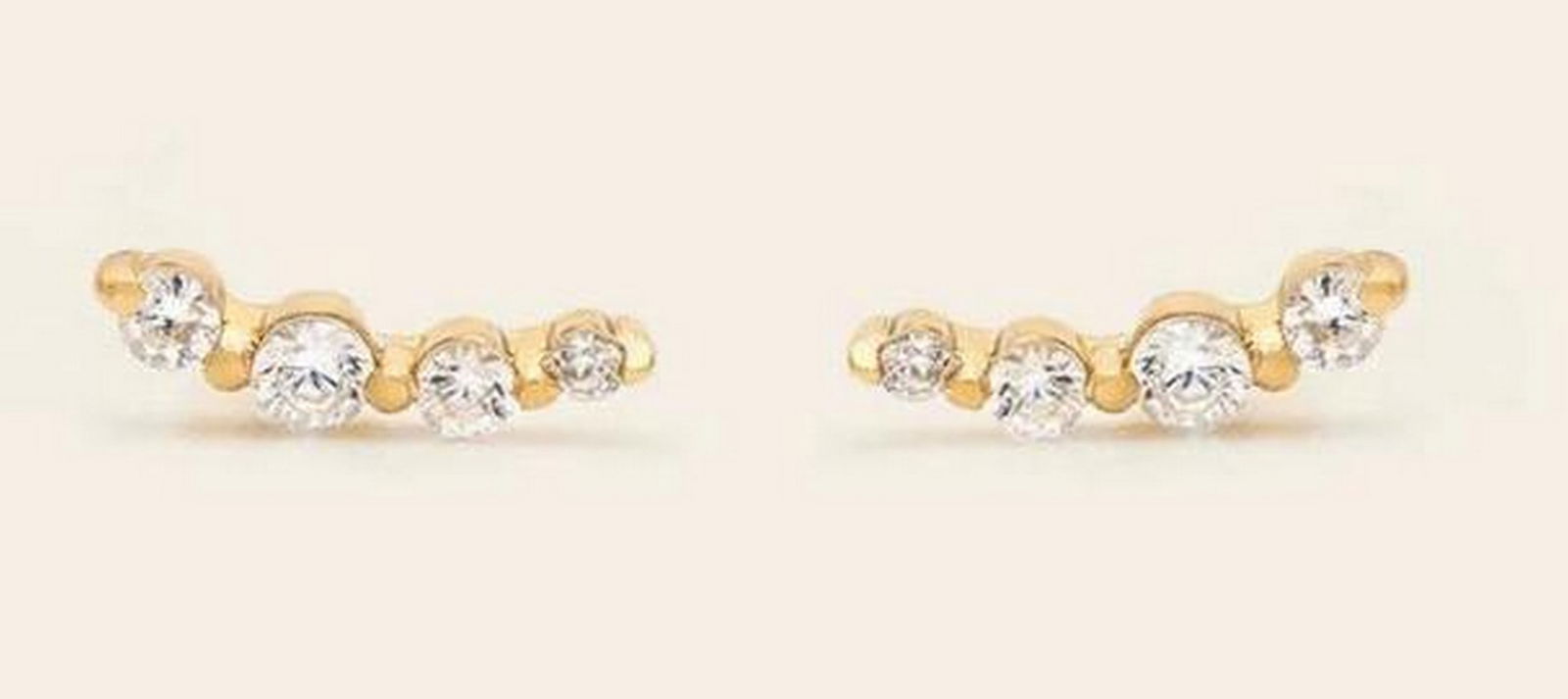 Sunrise Ear Climbers: Sunrise Ear Climbers Delicate ear climbers designed to follow the natural curve of the ear, adding subtle sparkle whether you have multiple piercings or wear them solo. Crafted in 14k gold vermeil