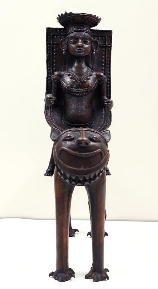 17" Dhokra Art Tribal Man Sitting on Lion: 17" Dhokra Art Tribal Man Sitting on Lion Sculpture made from brass using the traditional lost-wax casting technique. The piece depicts a tribal man seated on a lion, featuring detailed ornament