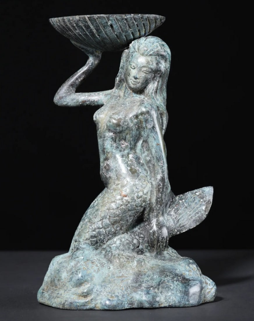 Brass Mermaid with Tealight Holder – 8": Brass Mermaid with Tealight Holder – 8" An 8-inch brass statue of a mermaid crafted using the lost wax technique. The figure features detailed incised lines across her scaled body, flowing hair