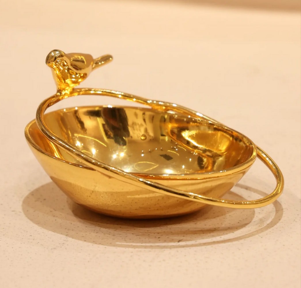 5" Brass Bird Bowl Urli – Superfine 24K Gold Plated Decorative Accent: 5" Brass Bird Bowl Urli – Superfine 24K Gold Plated Decorative Accent Modern home décor is evolving—moving beyond visual appeal to spark conversation and reflection. This Small Beautiful Bird