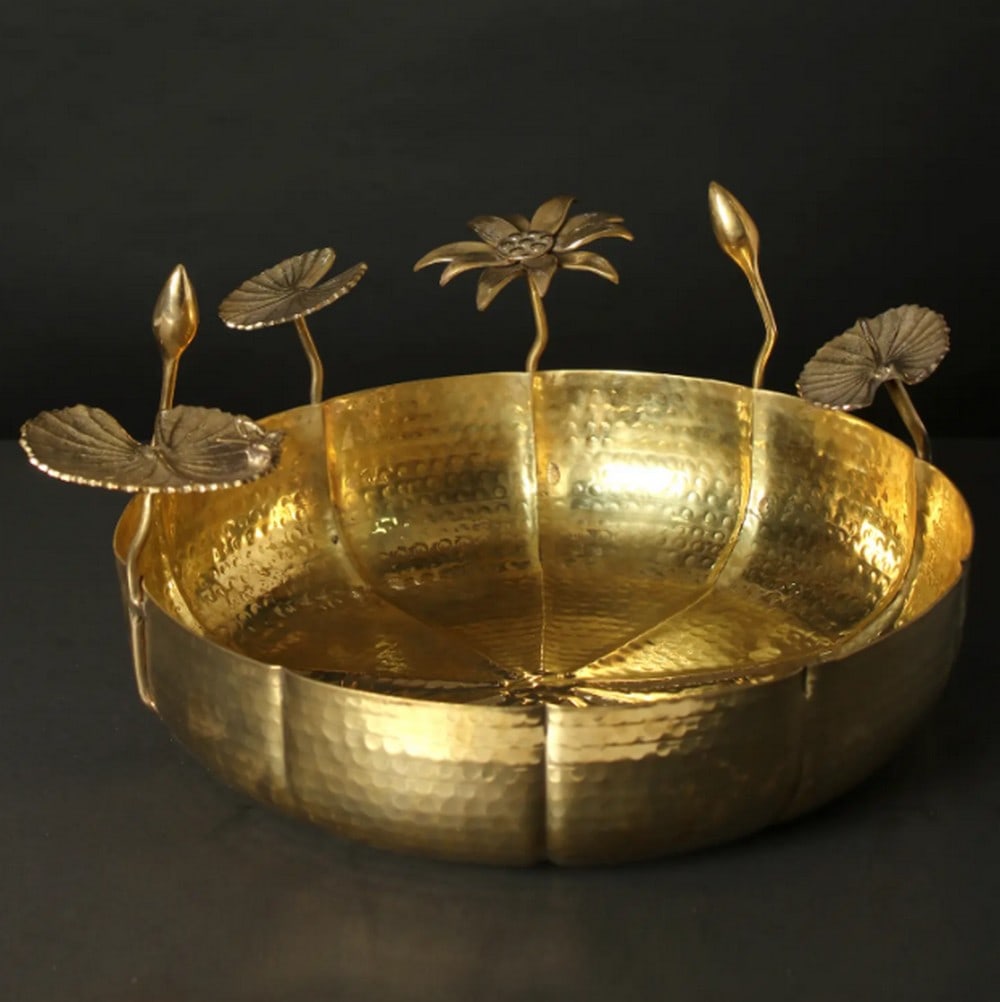 16" Brass Urli with Lotus Leaf Design – Elegant Traditional Décor Accent: 16" Brass Urli with Lotus Leaf Design – Elegant Traditional Décor Accent Lotus ponds, long celebrated in ancient Indian art and literature, symbolize purity, serenity, and divine beauty. In wor