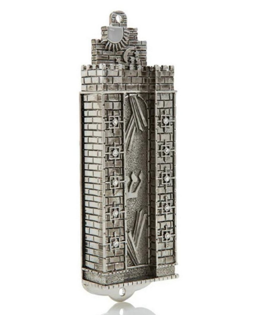 Silver Western Wall-Style Decorated Mezuzah: Silver Western Wall-Style Decorated Mezuzah Add a touch of modern sophistication to your home with the Silver Western Wall-Style Decorated Mezuzah. Crafted from pewter and plated with 925 silver, th
