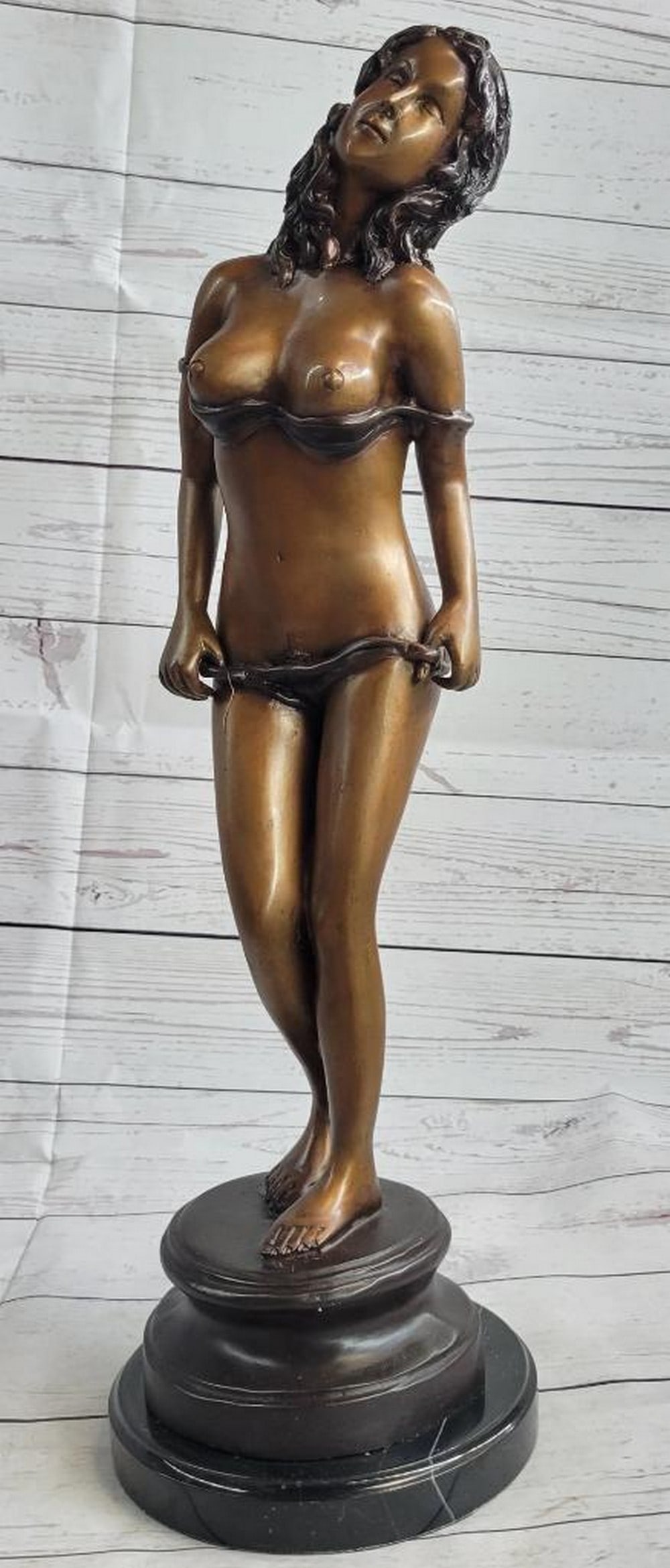 Signed Original Sensual Dancing Woman Bronze Sculpture - 21" x 7": The slender provocative woman is captured in a sensual dance. Her body can be seen swaying and twists side to side as she has removed each article of clothing except for her undergarment and high-heel