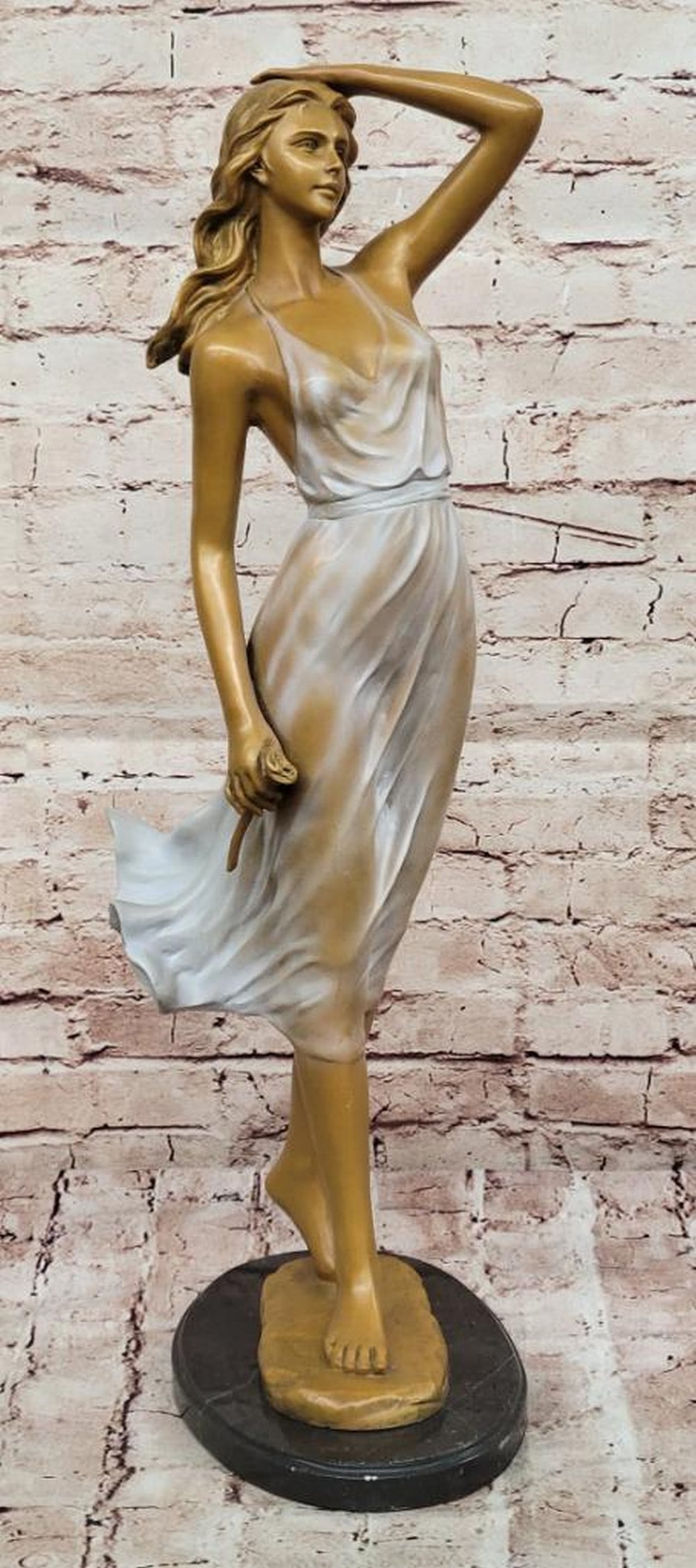 Elegant Lady Bronze Sculpture: Elegant Lady Bronze Sculpture Rose in Hand – Bronze Sculpture of Grace and Romance captures the timeless beauty of feminine elegance and romantic allure. This finely crafted piece features a poised