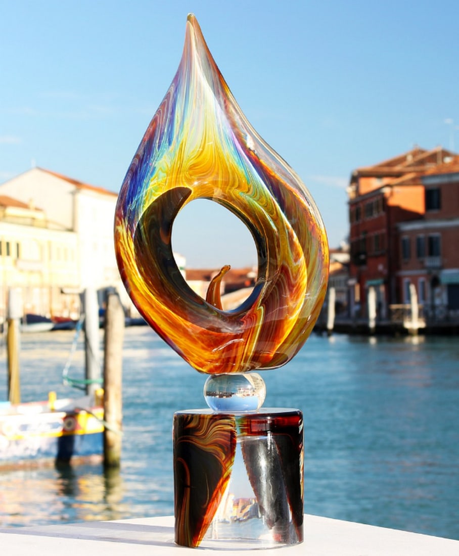 Calla Flower Chalcedony Glass Handcrafted Murano Glass: Calla Flower Chalcedony Glass Handcrafted Murano Glass This handcrafted Murano glass calla flower sculpture is made from chalcedony and clear glass. Sculpted entirely by hand, the piece displays shift
