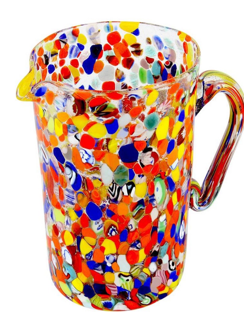 Polychrome Stains Pitcher – Murano Glass: Polychrome Stains Pitcher – Murano Glass This carafe is crafted using glassblowing techniques, featuring murrina decorations and macete—small pieces of glass that add vibrant colors. Ideal for eve