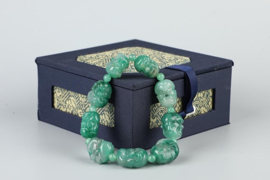 Timeless Elegance: Handcrafted Jade Bracelet: Timeless Elegance: Handcrafted Jade Bracelet A stunning handcrafted jade bracelet weighing 75 grams, celebrated for its smooth texture and natural sheen. This piece embodies traditional symbolism