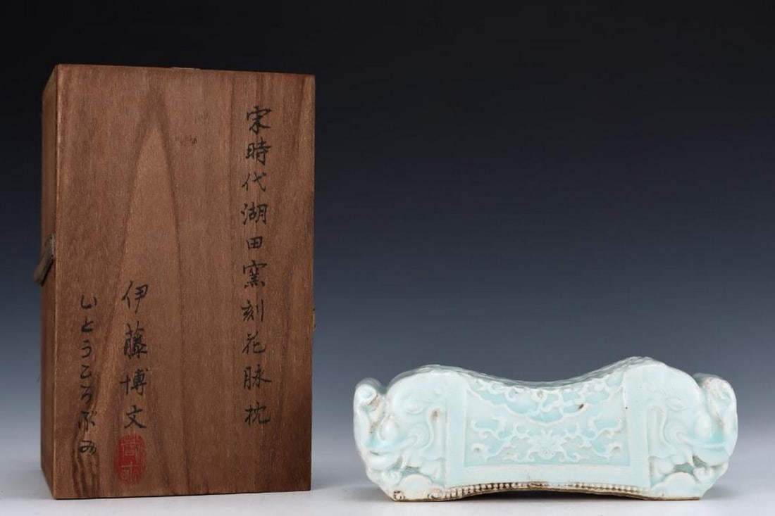 Inspired Antique Song Hutian Kiln Carved Flower Vein Pillow: Inspired Antique Song Hutian Kiln Carved Flower Vein Pillow A beautifully carved flower vein pillow inspired from the old Song Hutian kiln collection, showcasing intricate craftsmanship and delicate