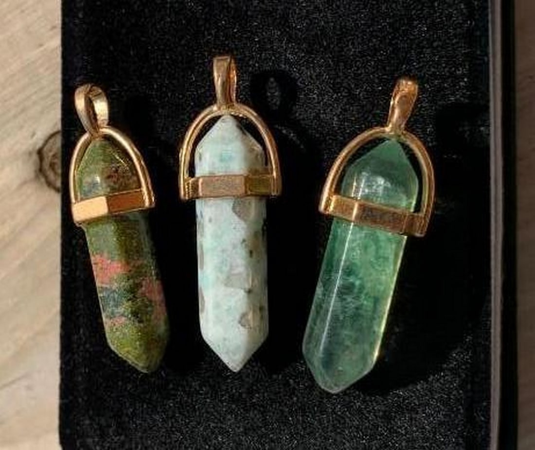 Set of 3 Healing Crystal Pendants: Earthy Greens and Natural Marbling: Set of 3 Healing Crystal Pendants: Earthy Greens and Natural Marbling This beautifully grounded set of three healing crystal pendants features soft, translucent light green, a white and green marbled