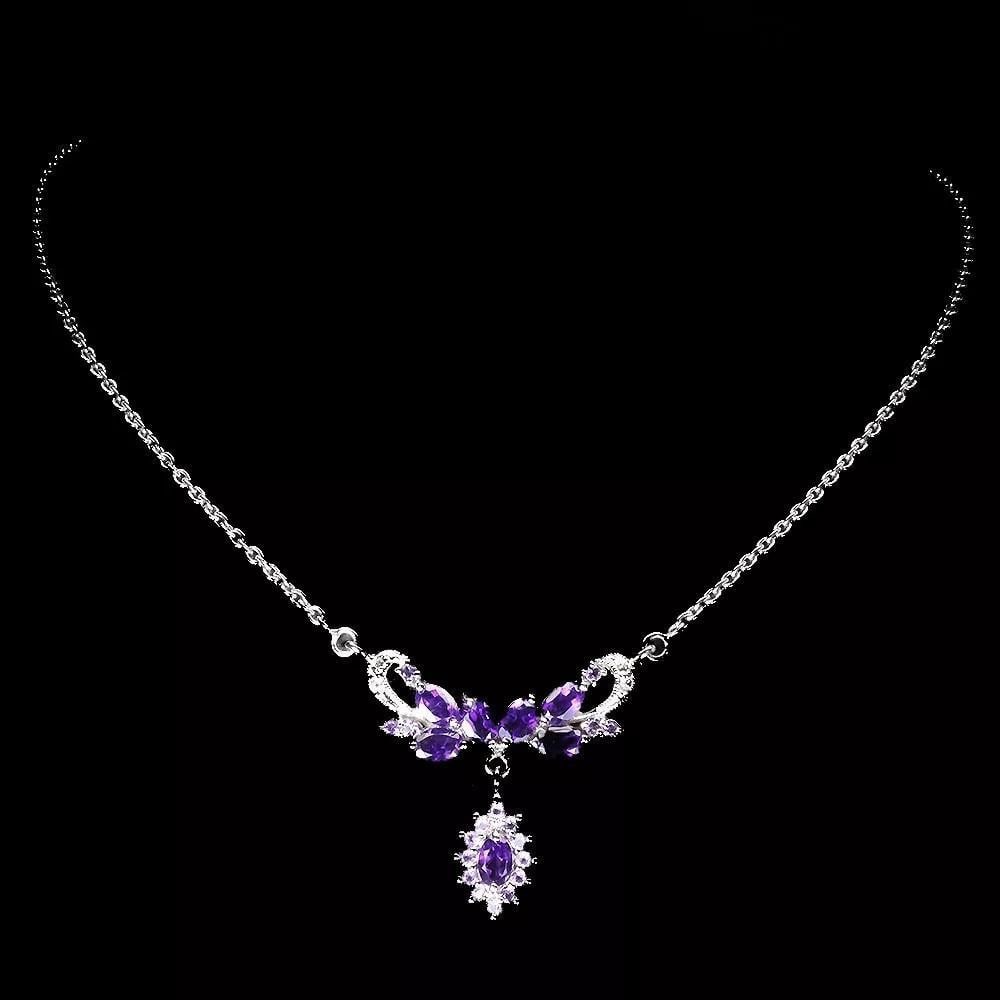 19" Sterling Silver Necklace with Oval Amethyst & Sapphire Gemstones: 19" Sterling Silver Necklace with Oval Amethyst & Sapphire Gemstones This exquisite sterling silver necklace features a captivating oval amethyst, elegantly complemented by sapphire gemstone a