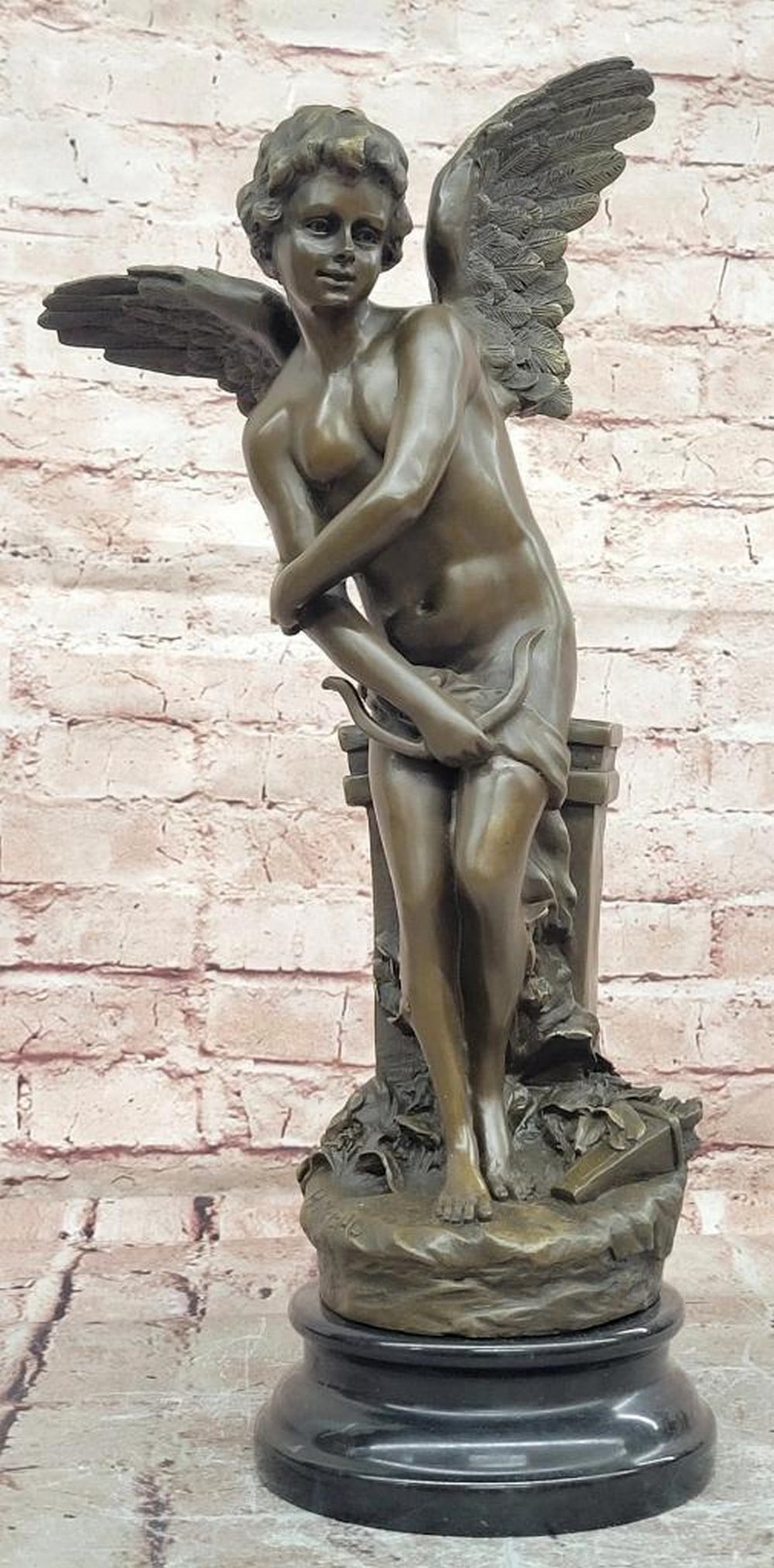 Moreau Cupid Bronze Sculpture on Marble Base – 18" x 9": Moreau Cupid Bronze Sculpture on Marble Base – 18" x 9" This bronze sculpture depicts Cupid in a graceful pose, rendered with attention to proportion, detail, and expressive movement. The c