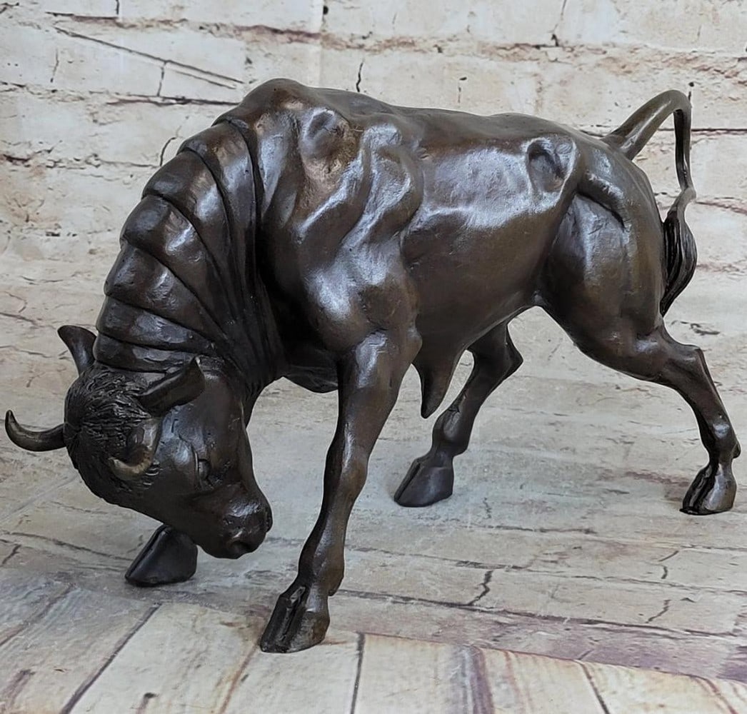 Fierce Bull Bronze Sculpture - 8" x 13": Fierce Bull Bronze Sculpture - 8" x 13" The male Bull trots along the grassy fields he calls home. His horns protrude out from the top of his head. The muscles in his body show through his sk