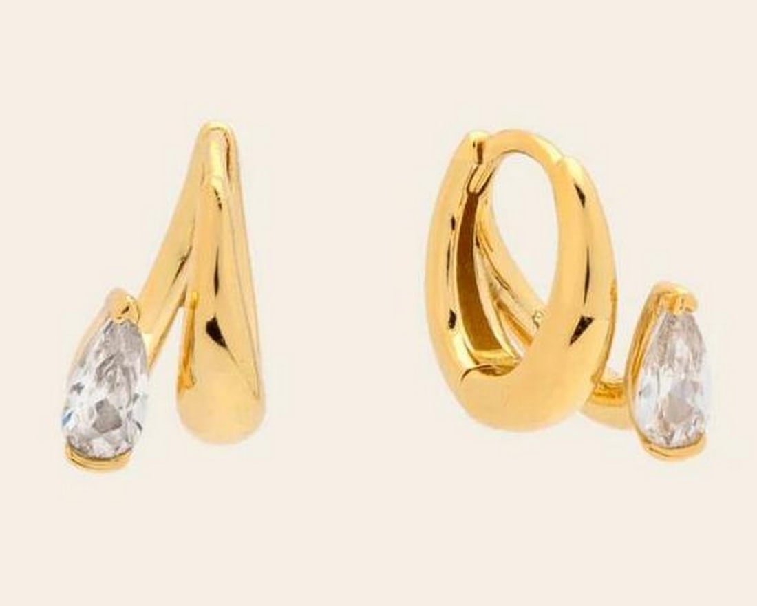 Golden Dewdrop Huggies: Golden Dewdrop Huggies Less stacking, more styling. The Dewdrop Huggie Earrings offer quiet luxury with a subtle teardrop shape and a soft, sparkling glow. Crafted in 14k gold vermeil and set with tea