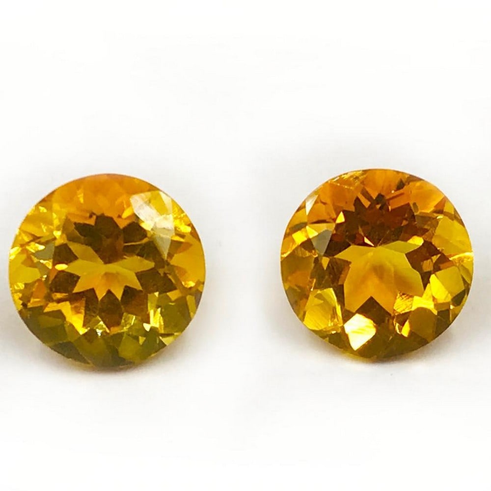 14.42ct Pretty Pair of Round Faceted Citrine Gemstone: Pretty Pair of Round Faceted Citrine Citrine is a popular type of quartz crystal often used to in conjunction with feng shui to welcome abundance, prosperity, and positivity. Size- 13 mm, Weight-