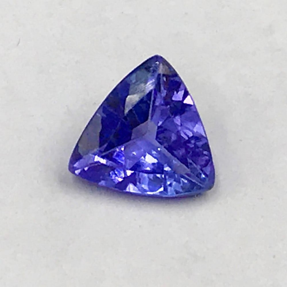 .92ct Faceted Tanzanite Trillion Gemstone: Faceted Tanzanite Trillion Tanzanite gems are believed to represent heart and intellect combined with intuition and purity. These stones are used as symbols of dignity, truth, judgement and
