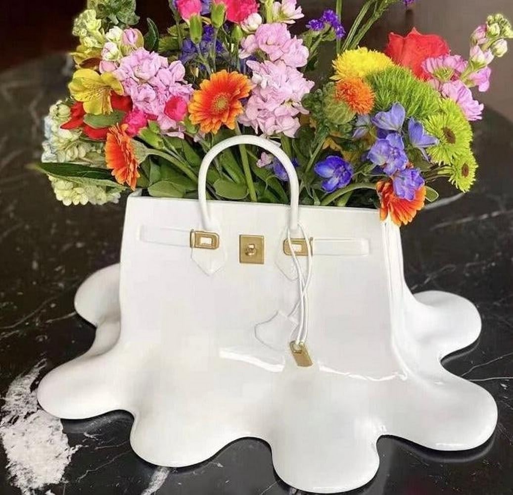 16" - Melting Fancy Vase In The Form Of A Vase: 16" - Melting Fancy Vase In The Form Of A Vase So Fancy Vase Bag is a functional vase but is also a beautiful art piece that will add a fun, sense of style to any space. This vase is always a