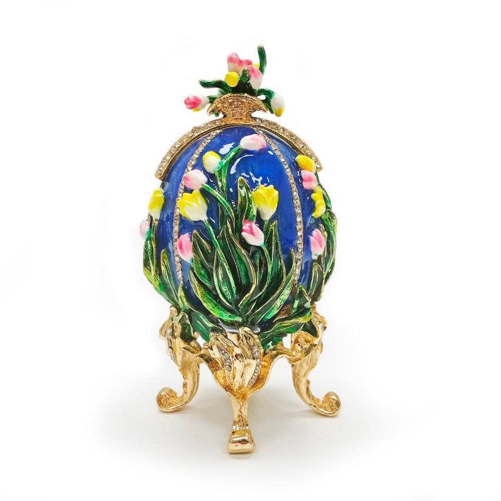 1898 Lilies of the Valley Royal Russian Inspired Egg: 1898 Lilies of the Valley Royal Russian Inspired Egg This sparkling egg is adorned with clear crystals and high-polished enamel with golden trim. The top slides out to expose a triple round picture