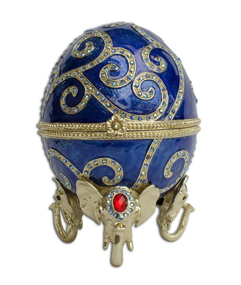 Bejewelled Royal Elephant Egg: Bejewelled Royal Elephant Egg The royal elephant is fashioned with sparkling crystals, and further hand enameled to add an attractive accent. Dimensions: 7.5&r