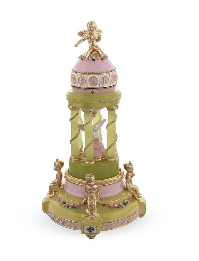 1910 Royal Russian Inspired Egg - The Colonnade Musical: 1910 Royal Russian Inspired Egg - The Colonnade Musical This hand-painted sparkling egg is adorned with a high-polished pink enamel with golden trim. It opens on a hinge and closes shut with a magnet