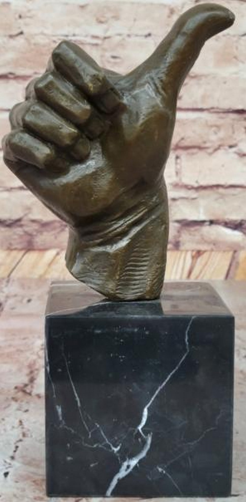 Affirmation Thumbs-Up Bronze Sculpture: Affirmation Thumbs-Up Bronze Sculpture Surreal and symbolic, this is a striking bronze sculpture of a thumbs-up, crafted in a bold, minimalist form and mounted on a sleek marble base. Bearing the sig