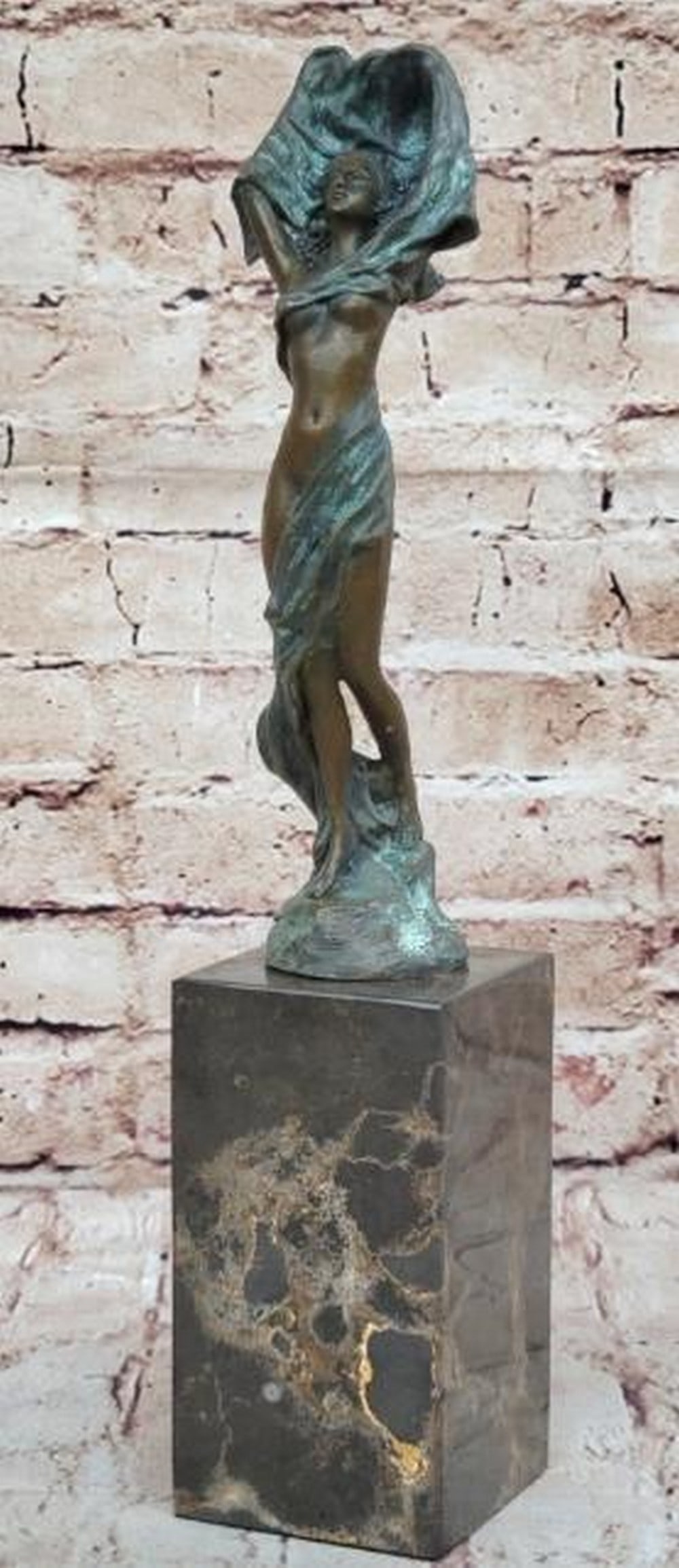 The Unveiling Woman Bronze Sculpture: The Unveiling Woman Bronze Sculpture This statue is a conceptual representation of a nude girl standing upright with a cloth loosely wrapped around her. Her hands are covered by a cloth that encircle