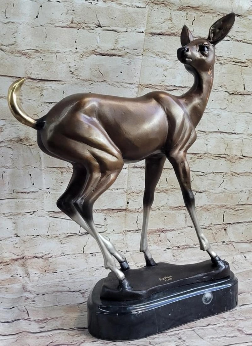 Young Fawn Bronze Sculpture: Young Fawn Bronze Sculpture This young fawn lifts his head in the middle of his grazing and lifts his ears up in alertness. He pauses and takes a second to look around and check out his surroundings.