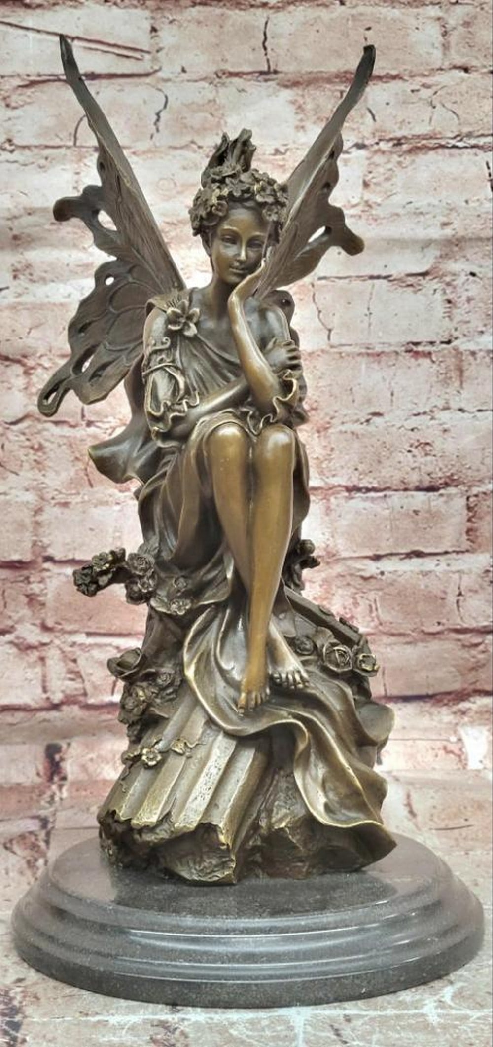 Mavchi Original Bronze Garden Forest Fairy Sculpture - 14.5" x 7.5": Mavchi Original Bronze Garden Forest Fairy Sculpture - 14.5" x 7.5" This original bronze sculpture depicts a garden forest fairy in a serene, graceful pose surrounded by floral elements. The f