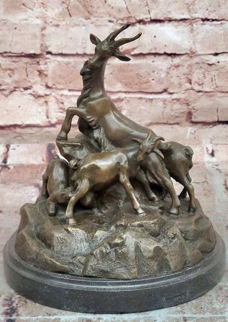 E. Delabrierre Bronze Mountain Goats Sculpture Reproduction - 8" x 6.75": E. Delabrierre Bronze Mountain Goats Sculpture Reproduction - 8" x 6.75" This bronze sculpture depicts a pack of mountain goats in lifelike poses, emphasizing movement, balance, and natural fo