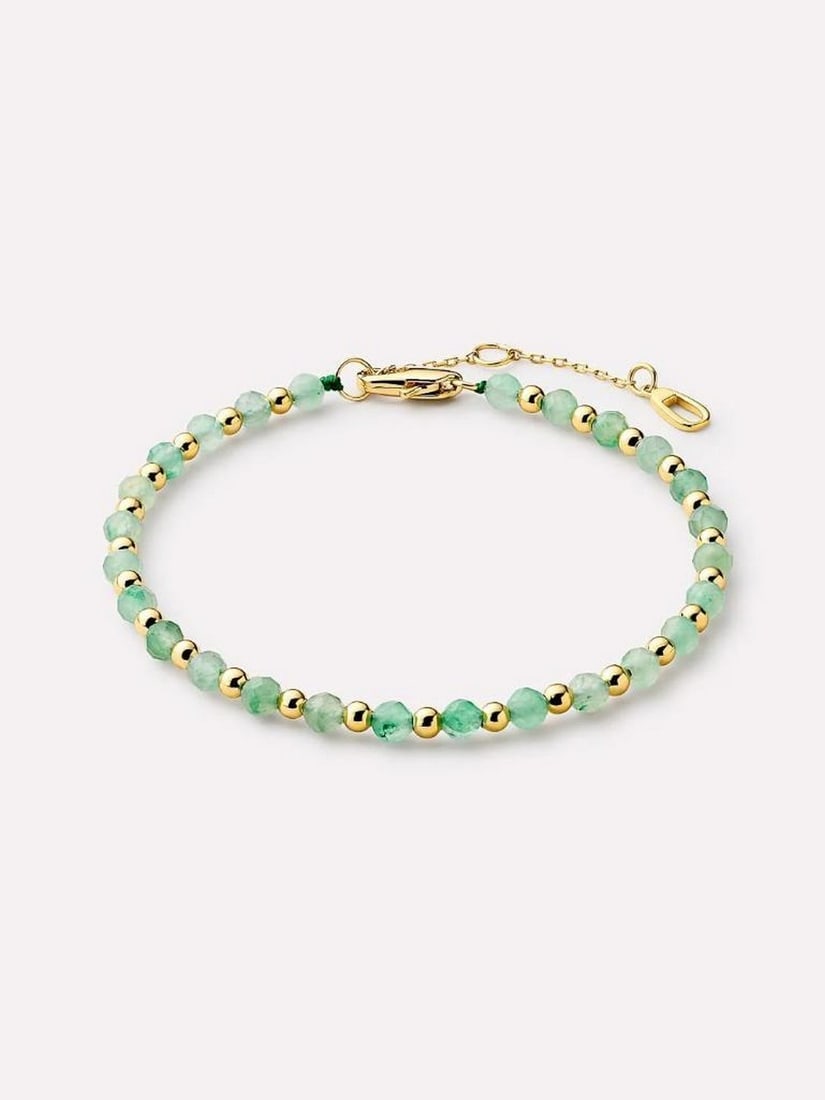 14K Gold-Plated Aventurine Bead Bracelet: 14K Gold-Plated Aventurine Bead Bracelet Add a pop of color to your stack with this bold bead bracelet. Simple yet striking, it features rich green aventurine beads paired with 14K gold-plated accent