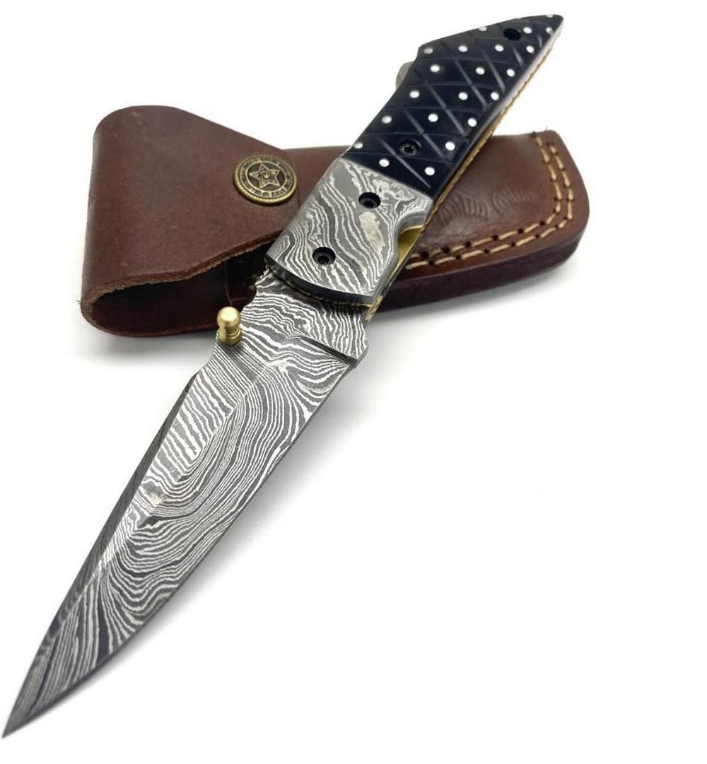 7.5" Hatreds Point Folding Damascus Knife: 7.5" Hatreds Point Folding Damascus Knife Custom Handmade Damascus Steel Hunting, Camping & Folding Knife Handle Bull Horn with Brass Pins. Damascus Steel Blade with 256 Layers on it. 