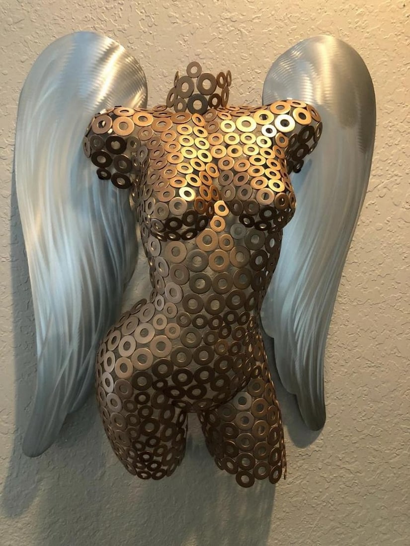 Rose Gold Guardian Metal Sculpture: Rose Gold Guardian Metal Sculpture This exquisite female torso sculpture embodies grace and strength, enhanced by elegantly crafted wings. Hand-formed and meticulously welded, its fine-textured detai