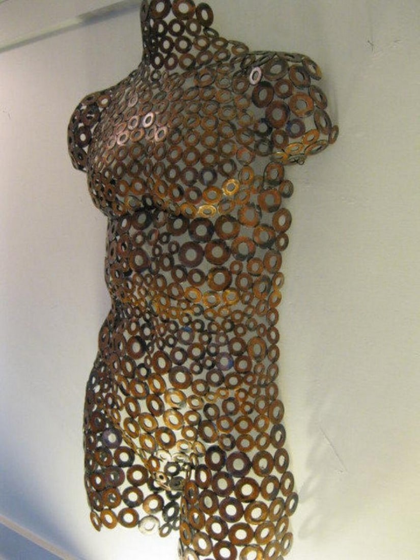 Ken Metal Sculpture: Ken Metal Sculpture A bold fusion of strength and artistry, Ken is a handcrafted male torso sculpture finished in rich bronze and copper tones with a distressed patina. The finely textured surface,