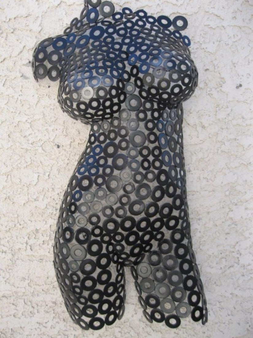 Black Widow Metal Sculpture: Black Widow Metal Sculpture A striking fusion of strength and elegance, Black Widow is a handcrafted female torso sculpture that commands attention. The polished textures and deep black finish,