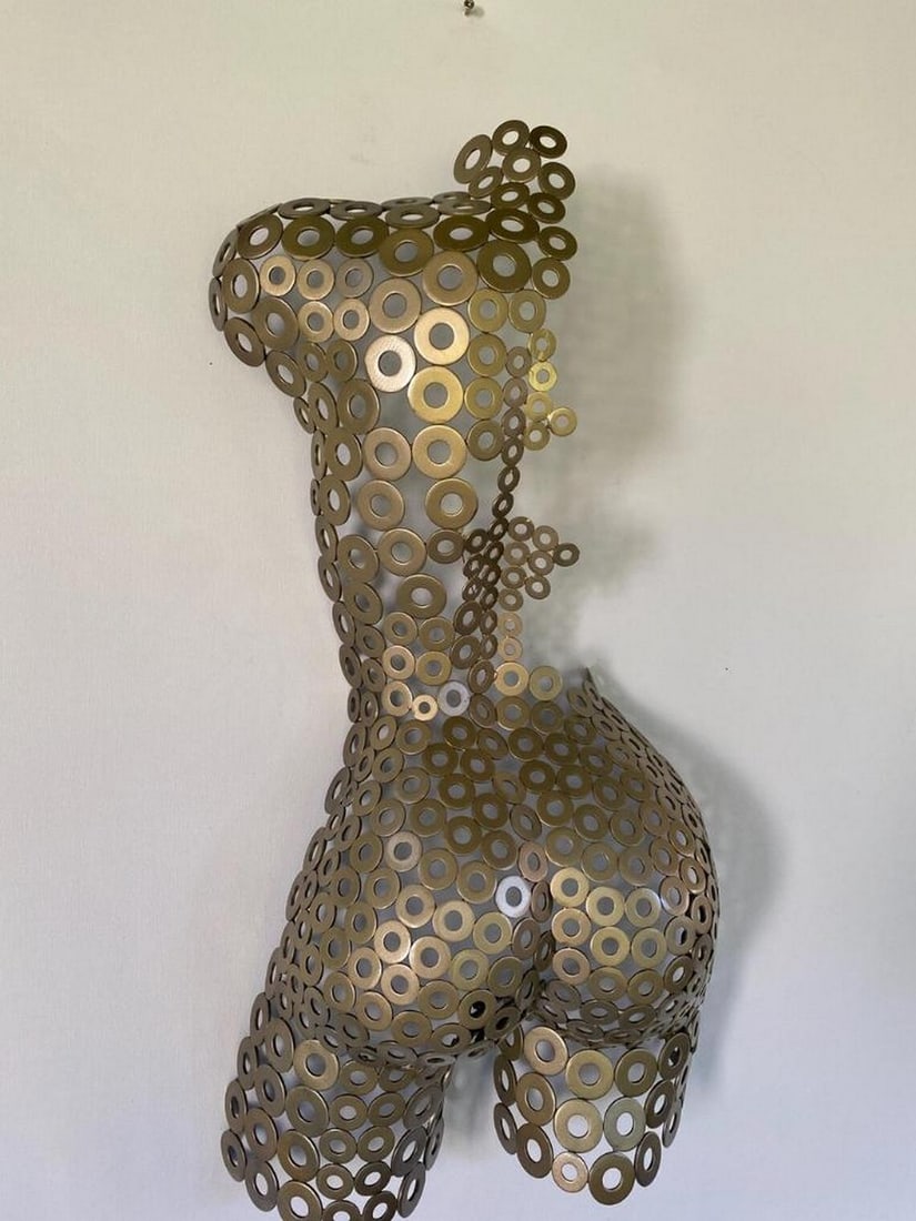 Milli Metal Sculpture: Milli Metal Sculpture This stunning handmade female torso, crafted by the artist, is a beautiful testament to the fusion of sculpture and metalwork. Each piece is uniquely hand-formed and welded,