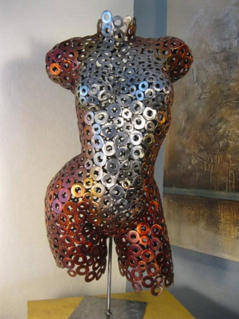 Anna in Crimson Metal Sculpture: Anna in Crimson Metal Sculpture This striking life-size female torso captures elegance and movement, expertly hand-formed and welded. The fine-textured surface, created through meticulous polishing