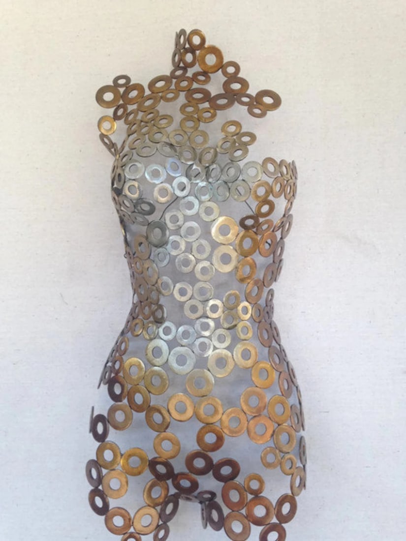 Gold/Silver Metal Female Torso Sculpture: Gold/Silver Metal Female Torso Sculpture This magnificent female torso was hand-formed and welded, making each piece unique and a perfect addition to any art collection. The artwork goes beyond the me