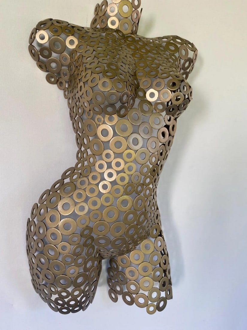 Gold Metal Female Torso Sculpture: Gold Metal Female Torso Sculpture Handcrafted, this stunning female torso is finished in gold, making each piece one-of-a-kind and a perfect complement to any art collection. The work goes beyond meta