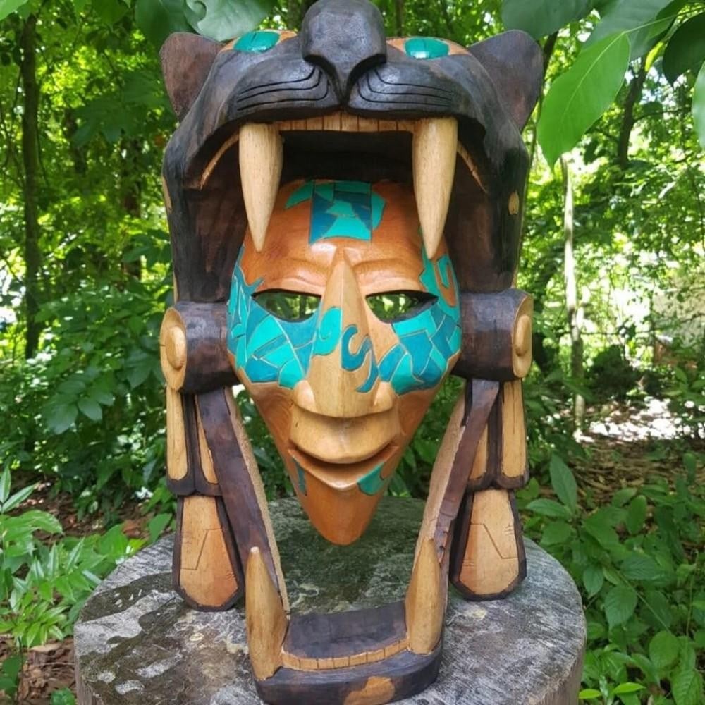 Jaguar Warrior 3D Wooden Mask: Jaguar Warrior 3D Wooden Mask This handcrafted wooden mask beautifully represents a 3D depiction of the Jaguar warrior, one of the elite soldiers in Aztec culture. Revered for their strength, courage,