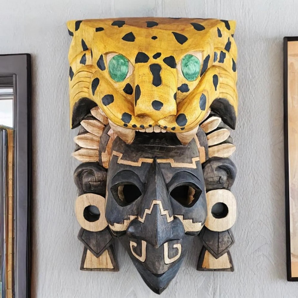 Hand Carved Aztec Jaguar Warrior Mask: Hand Carved Aztec Jaguar Warrior Mask This mask features a striking 3D depiction of a Jaguar Warrior, an elite infantry soldier of the Aztec army. Jaguar Warriors, along with Eagle Warriors, formed t