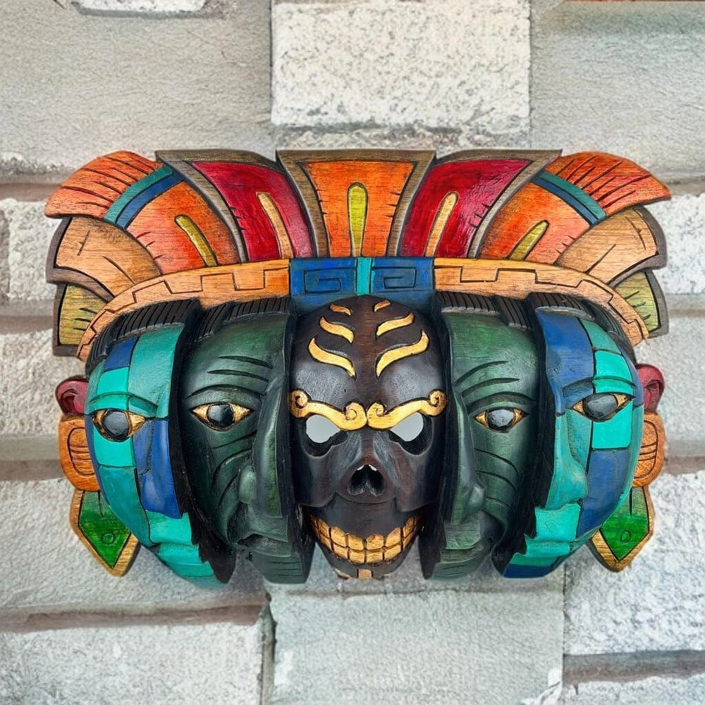 Hand Carved Mayan Reincarnation Mask: Hand Carved Mayan Reincarnation Mask This Mayan mask represents the cyclical journey of life and the afterlife, as understood by the Mayas. With three layered faces, the inner face symbolizes birth, t
