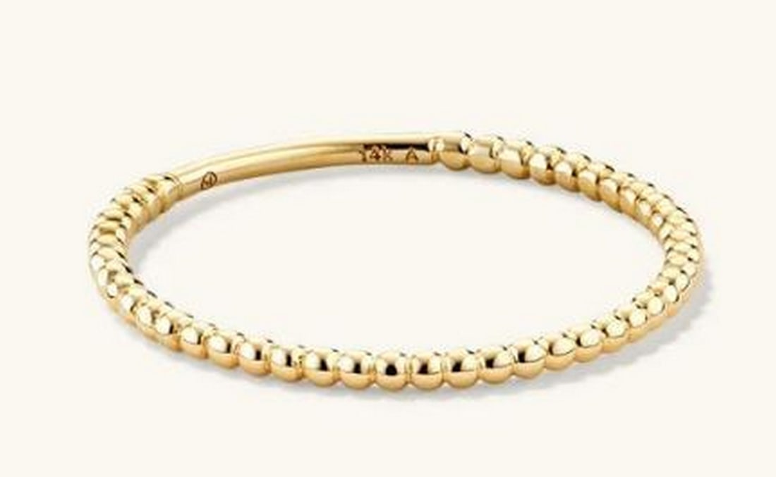 14K Yellow Gold Honeydrop Ring: 14K Yellow Gold Honeydrop Ring. Crafted from 14K yellow gold, this delicate yet captivating ring features a beaded design reminiscent of glistening honey droplets. Each smooth, rounded bead catches th