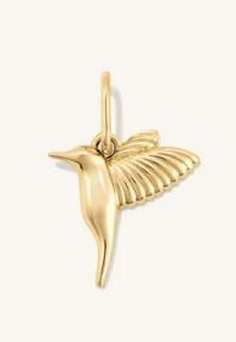 Golden Wings Hummingbird Charm: Golden Wings Hummingbird Charm. This delicate charm captures the beauty and grace of nature in a timeless design. Crafted from radiant 14K yellow gold, it features intricate detailing that brings