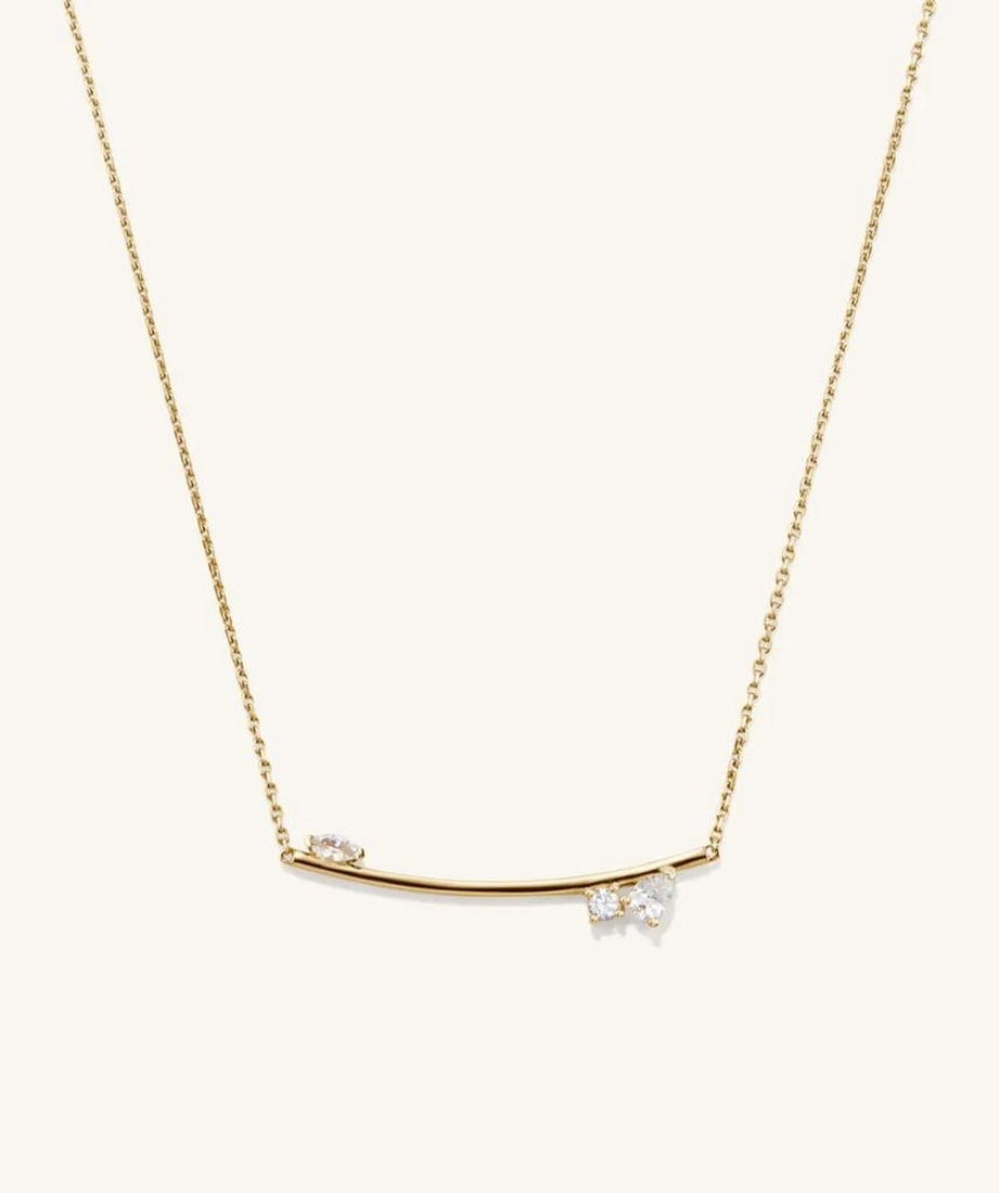 18k Gold Vermeil Bar Necklace with White Sapphires: 18k Gold Vermeil Bar Necklace with White Sapphires Inspired by clusters of constellations in the night sky, this 18k Gold Vermeil Bar Necklace features a gold bar adorned with lab-grown white sapphire